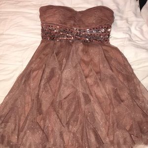 pink , sparkly , strapless , & short dress .
